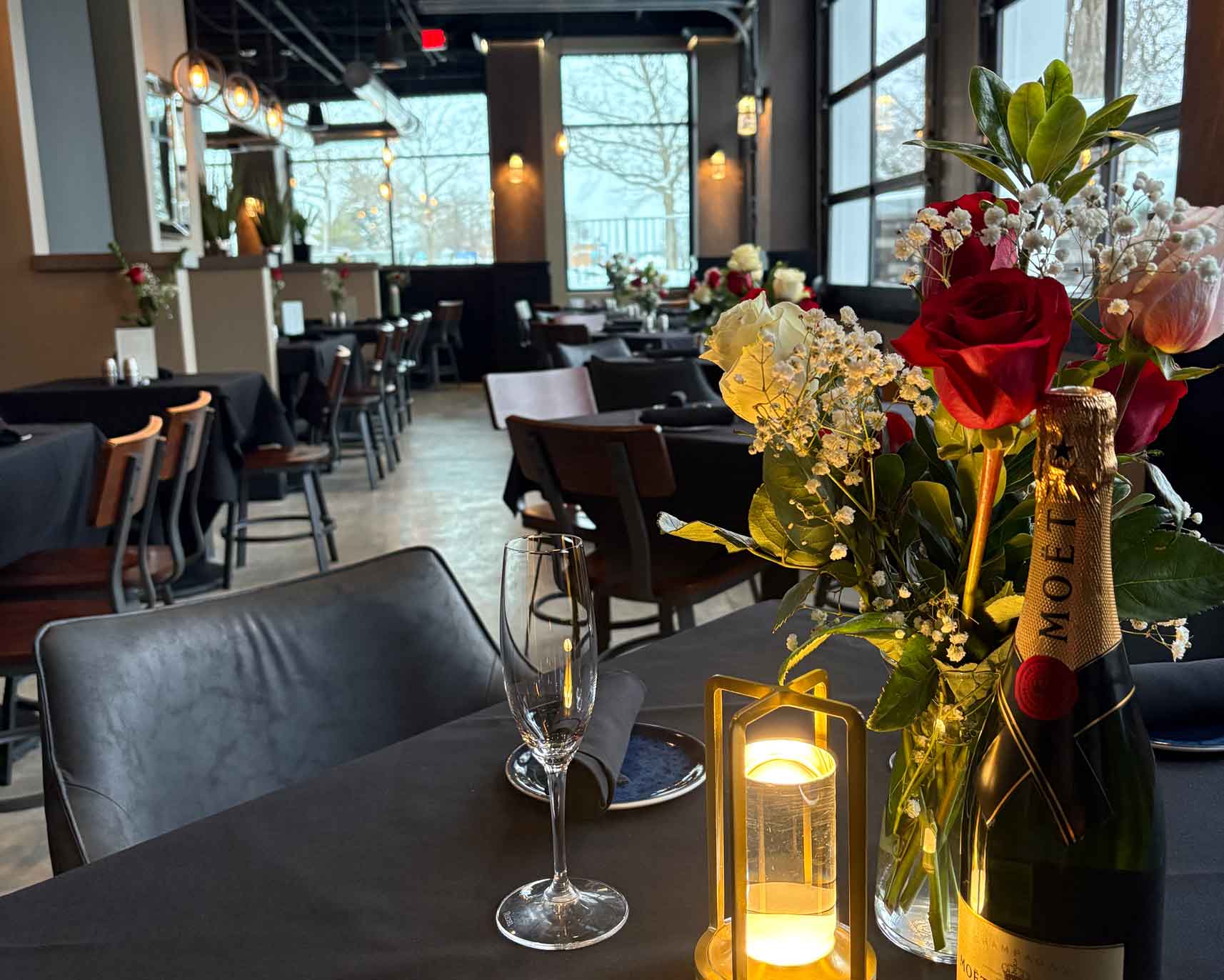 Seated corporate dinner with curated plates and attentive service at The Tasting Room in Traverse City