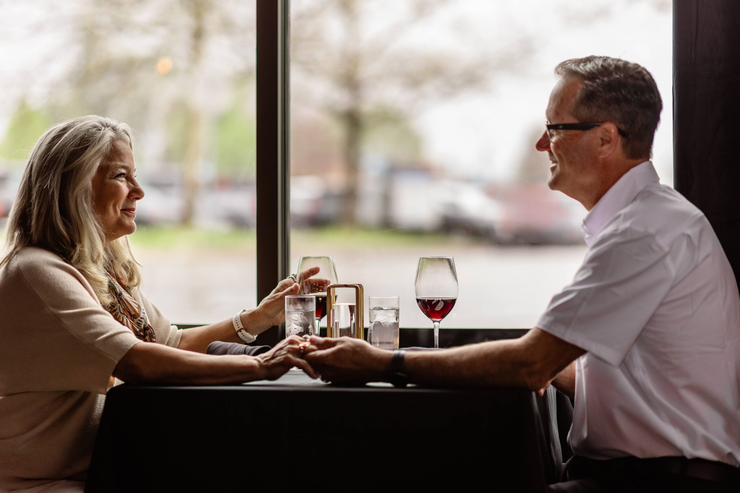 Couple enjoying wine during Date Night at Cellar & Flame in downtown Traverse City
